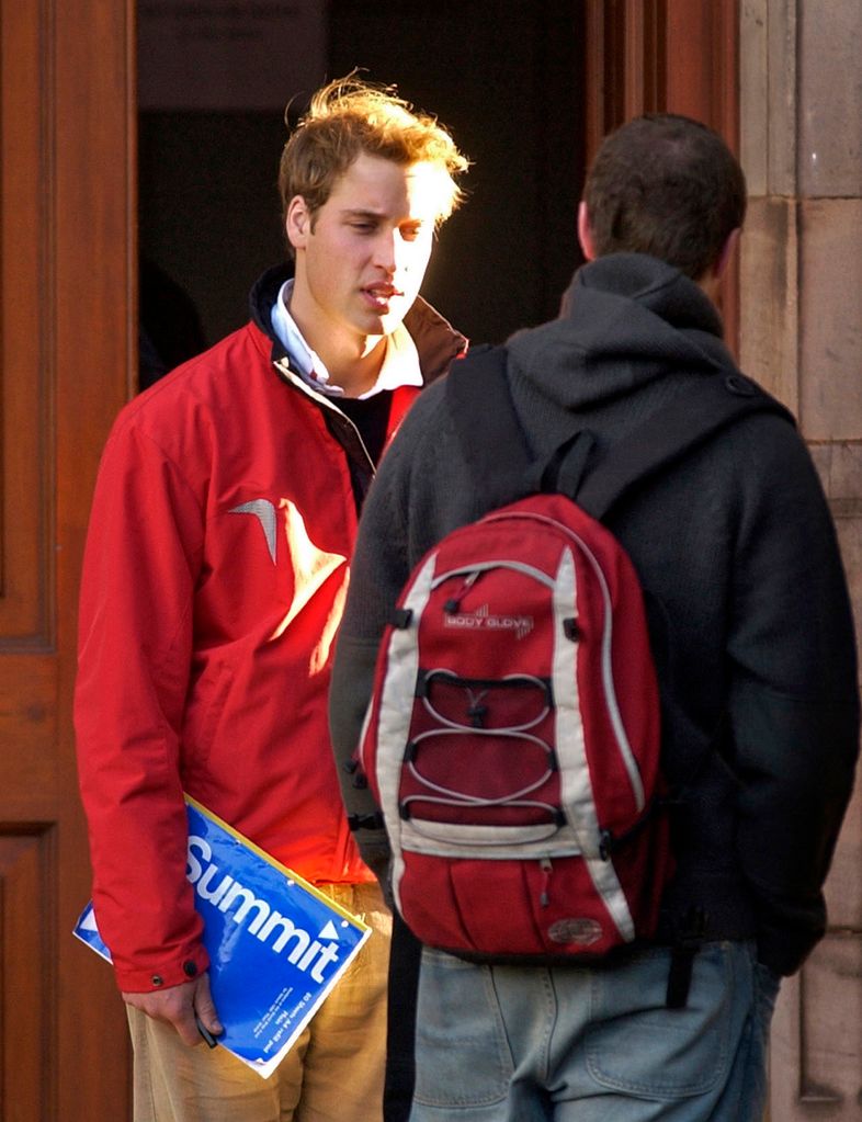 Prince William talking to a fellow student at university