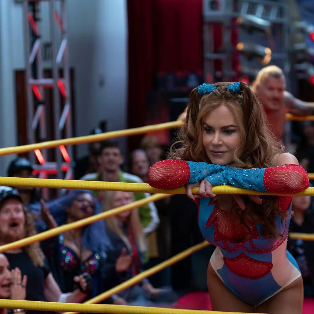 Nicole Kidman in red and blue bodysuit in boxing ring in Margo's Got Money Troubles