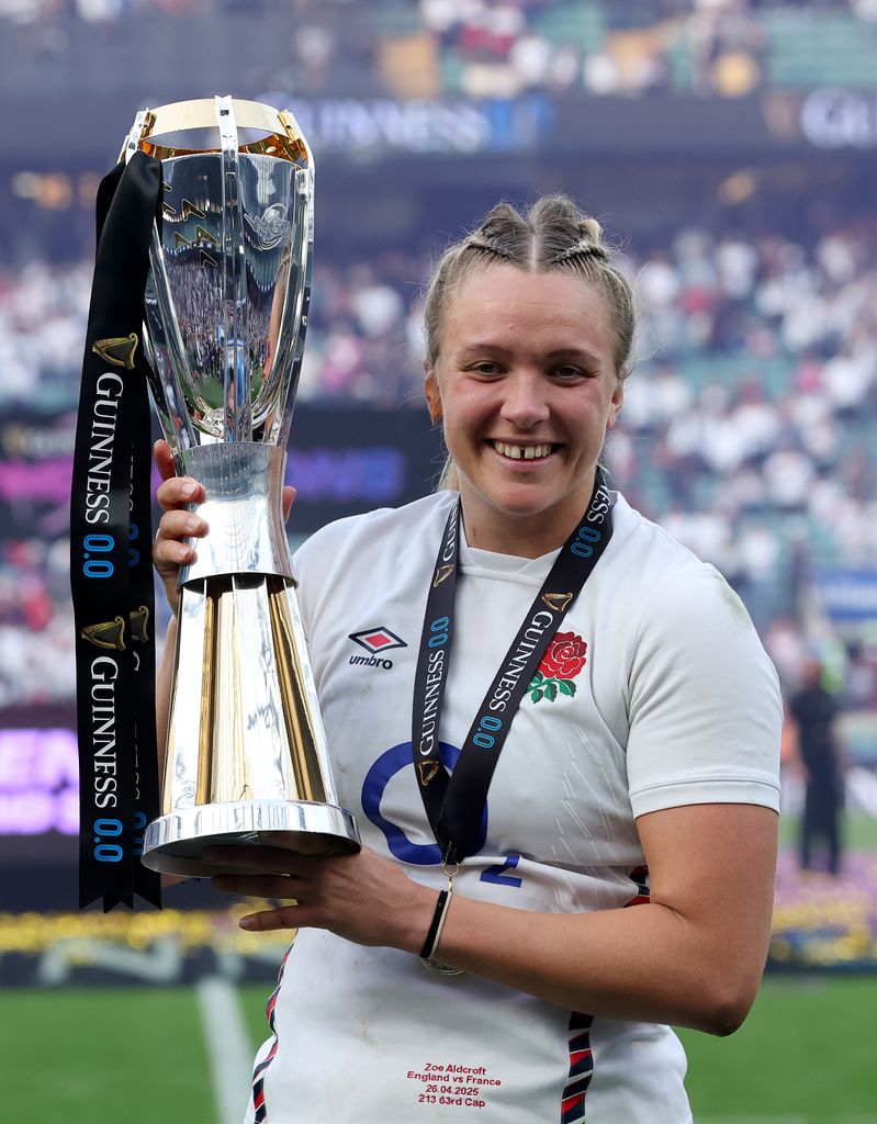Zoe Aldcroft of England poses for a photograph with the Guinness Women's Six Nations trophy