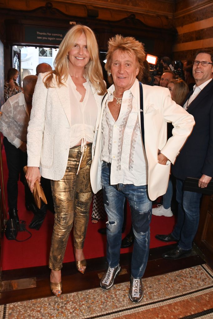 Penny Lancaster and Sir Rod Stewart in white at event