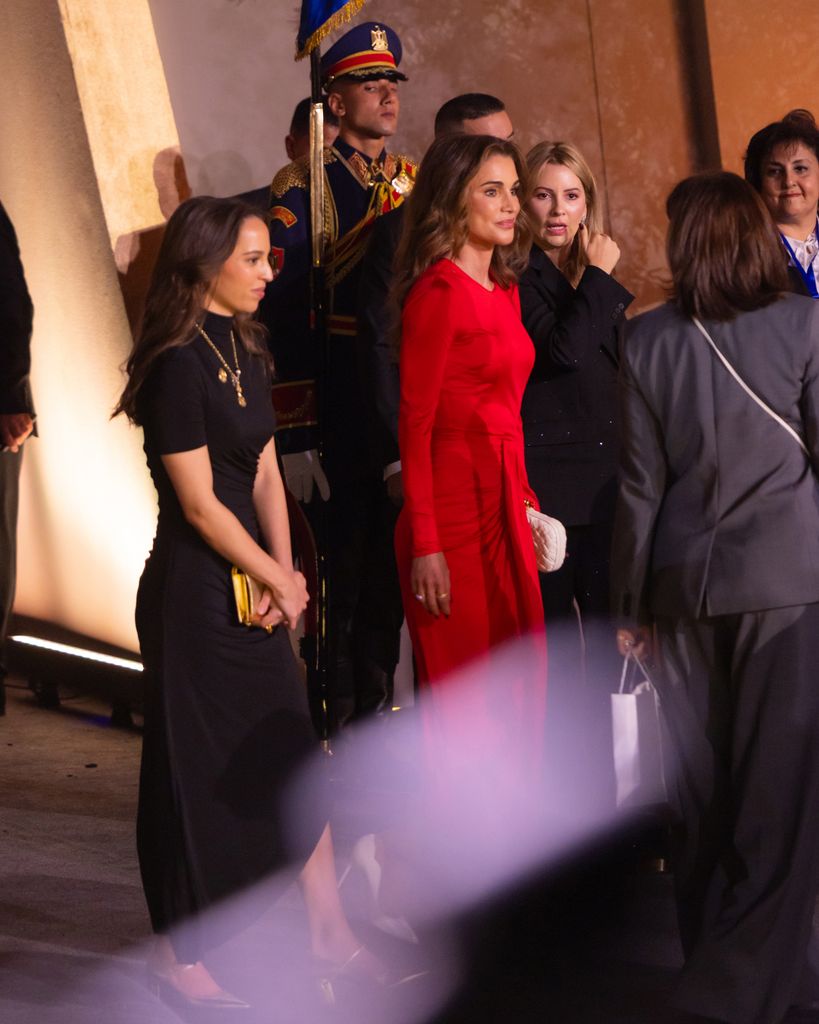 Queen Rania in red dress with her daughter Princess Salma