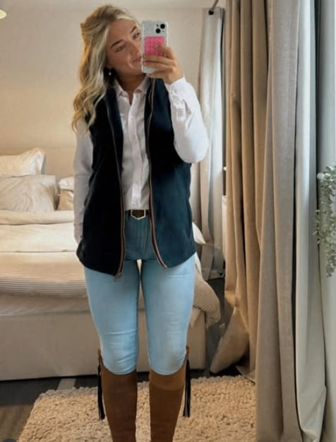 woman taking selfie in bedroom