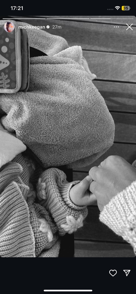 Michelle Keegan holding Palma's hand in matching sweaters