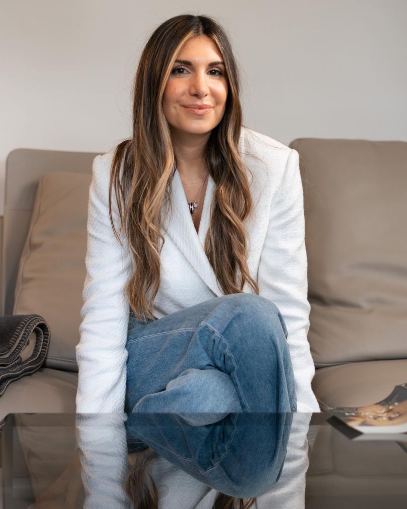 Dr. Limor Gottlieb in jeans and a white blazer