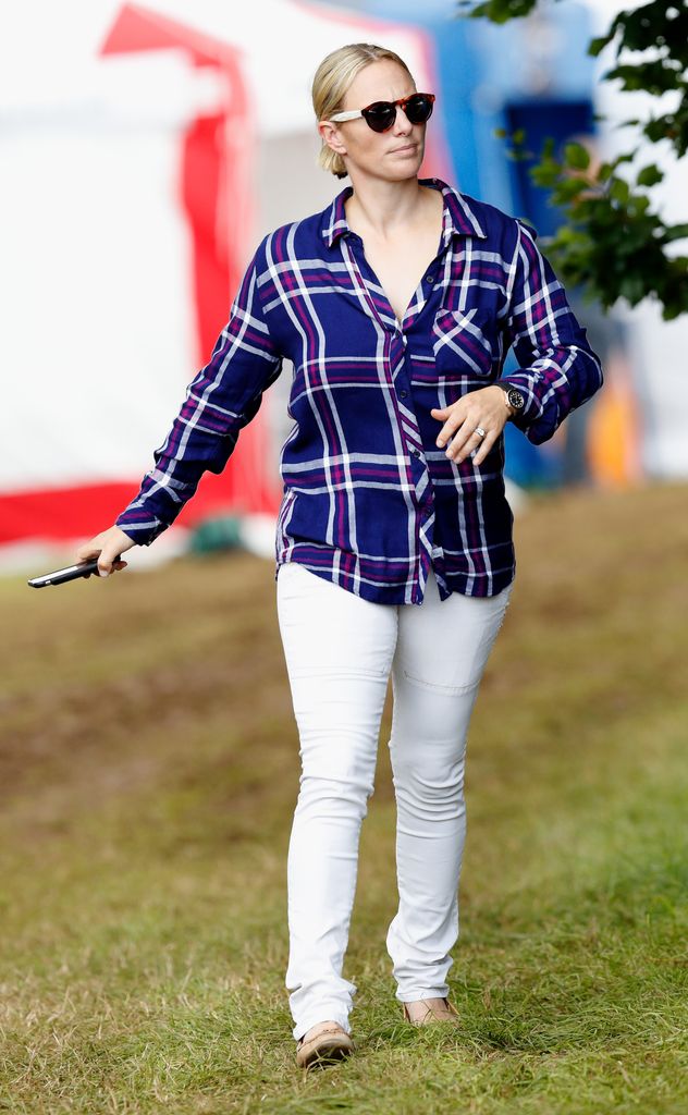 Zara Tindall in sunglasses and blue checked shirt at Festival Of British Eventing At Gatcombe Park