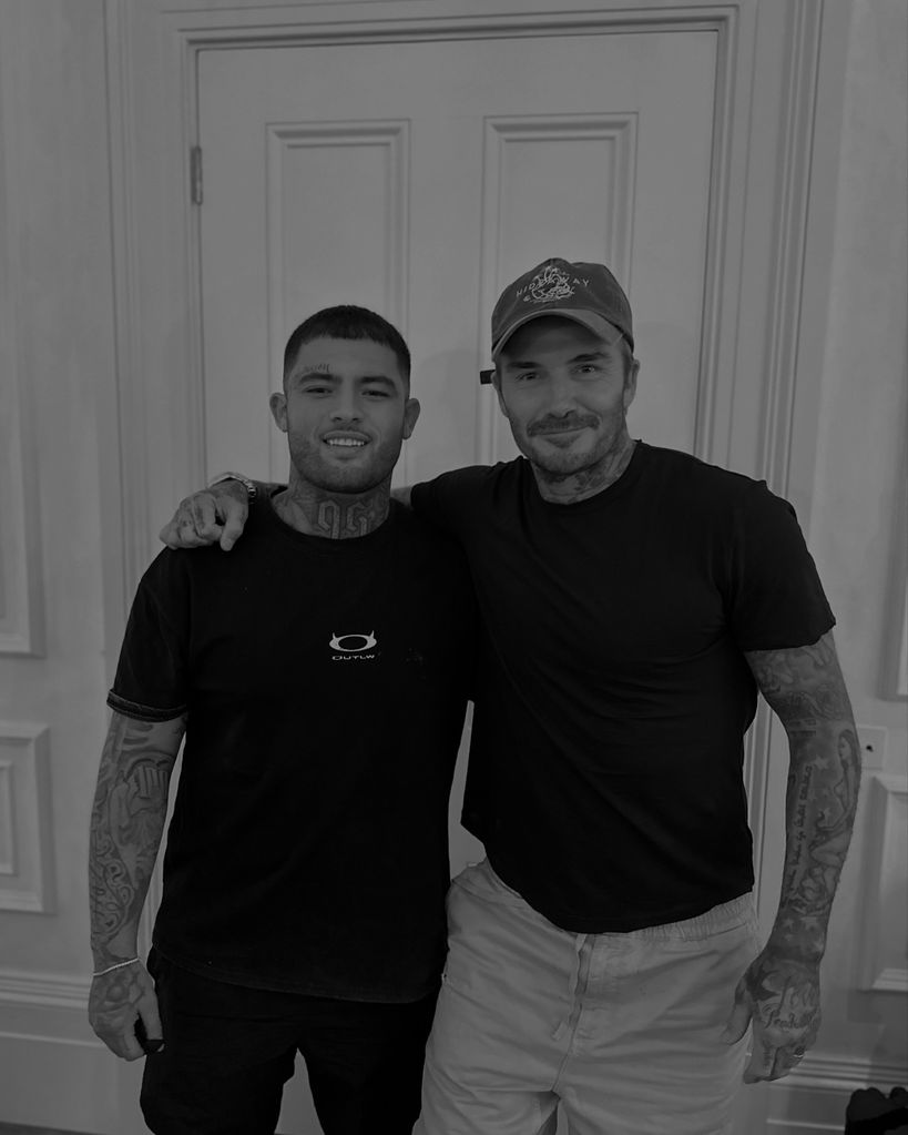 two men smiling in tattoo studio 