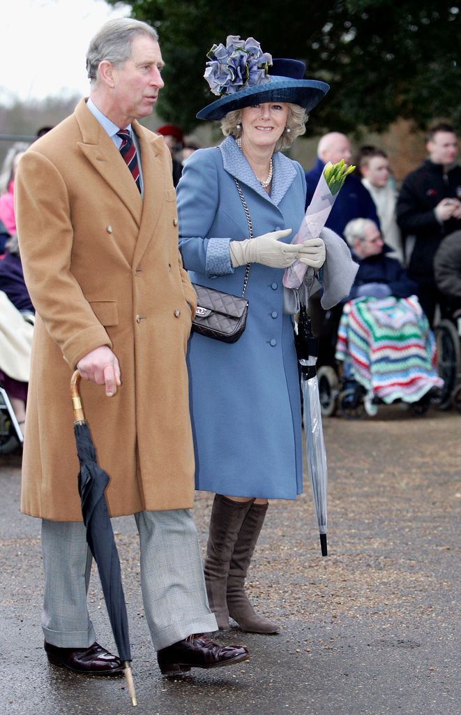 Prince Charles and his wife Camilla, in coats