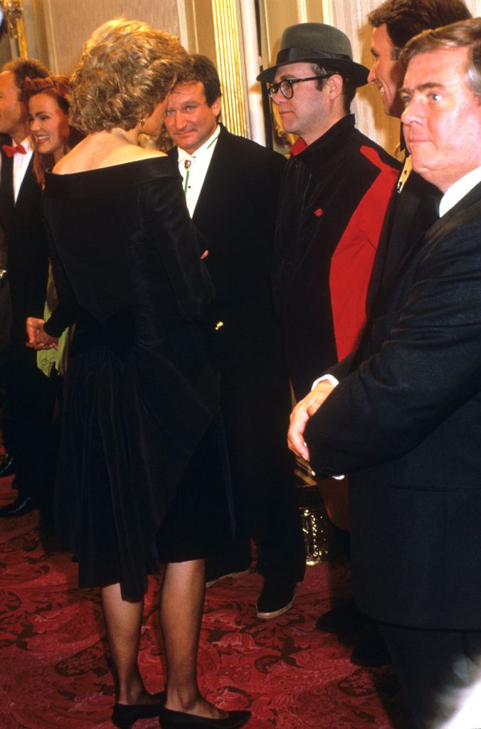 Princess Diana talking with Elton John