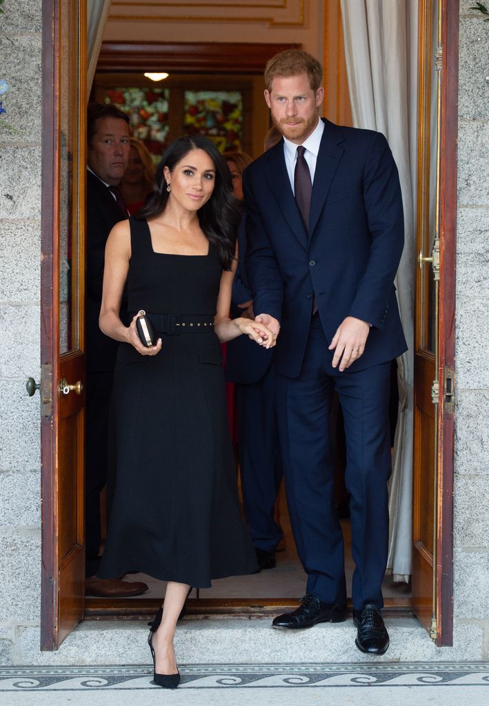  Prince Harry, Duke of Sussex and Meghan in black dress