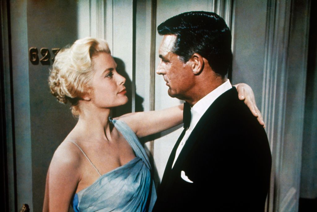 American actress and Princess consort of Monaco Grace Kelly hugging American actor Cary Grant in the film To Catch a Thief