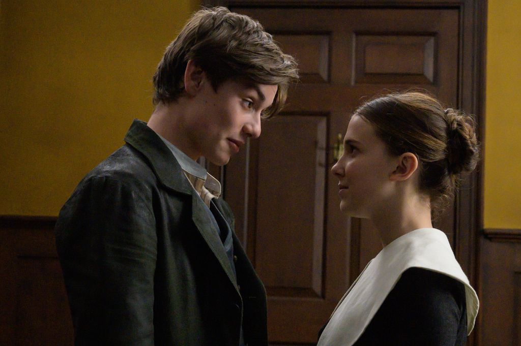 Louis Partridge and Millie Bobby Brown in a still image from Enola Holmes