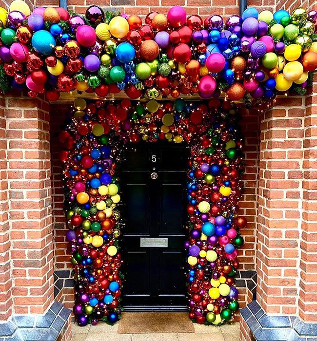 tom fletcher multi coloured baubles around door 