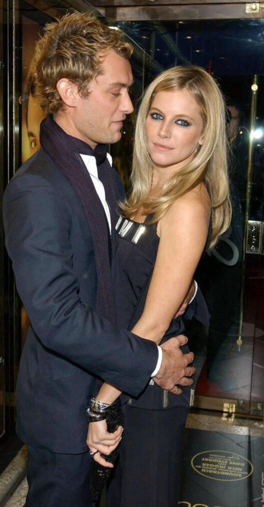 Jude with his arms around Sienna