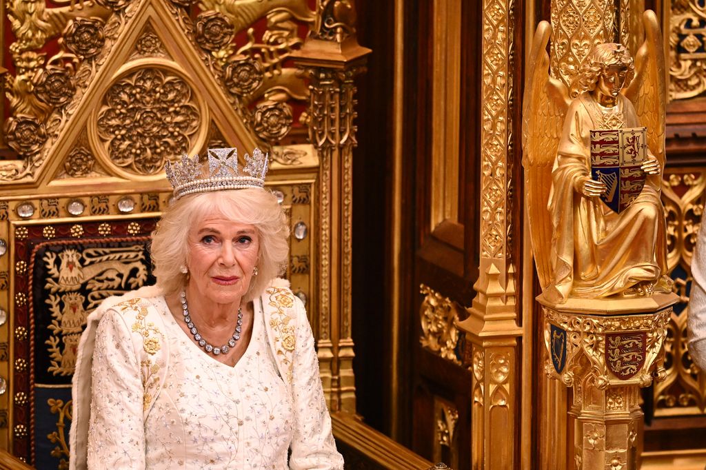 queen camilla wearing white dress in House of Lords Chamber