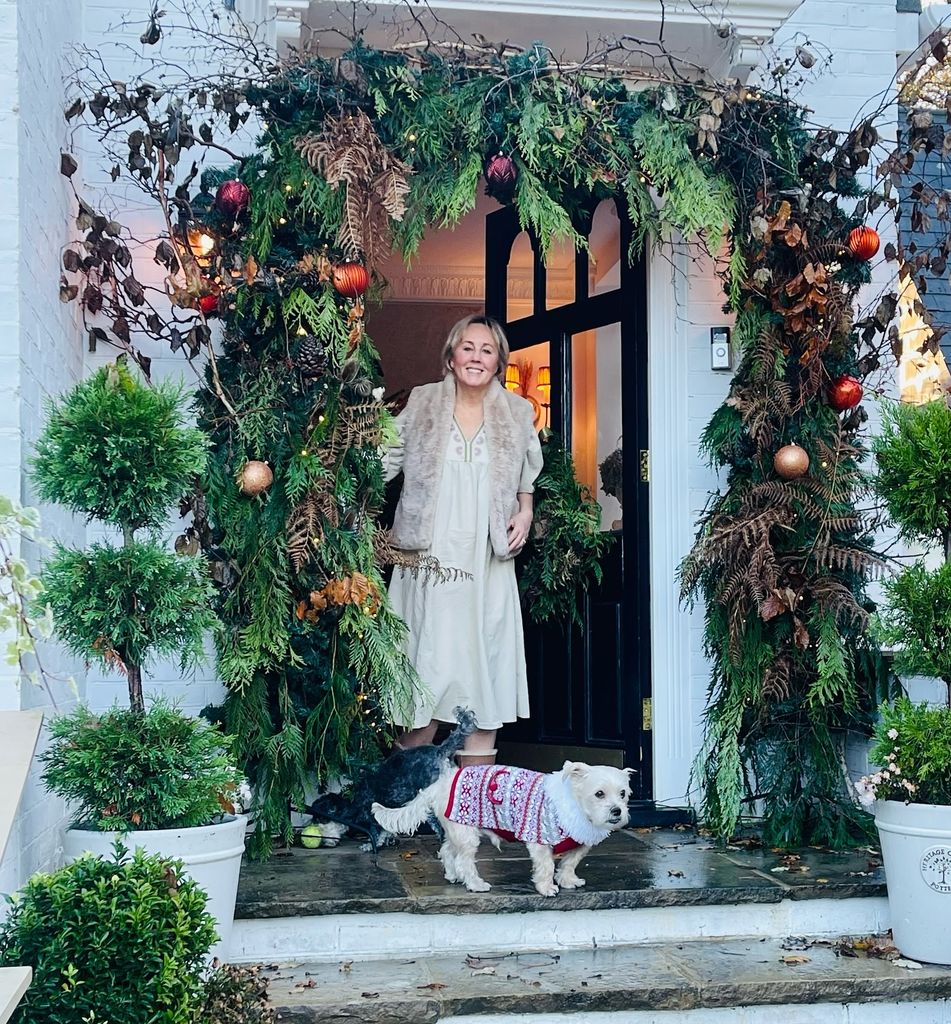 Shirlie Kemp in front of her door with her dog