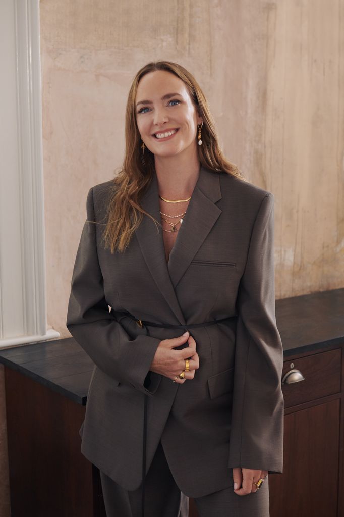 marisa horden in a grey suit