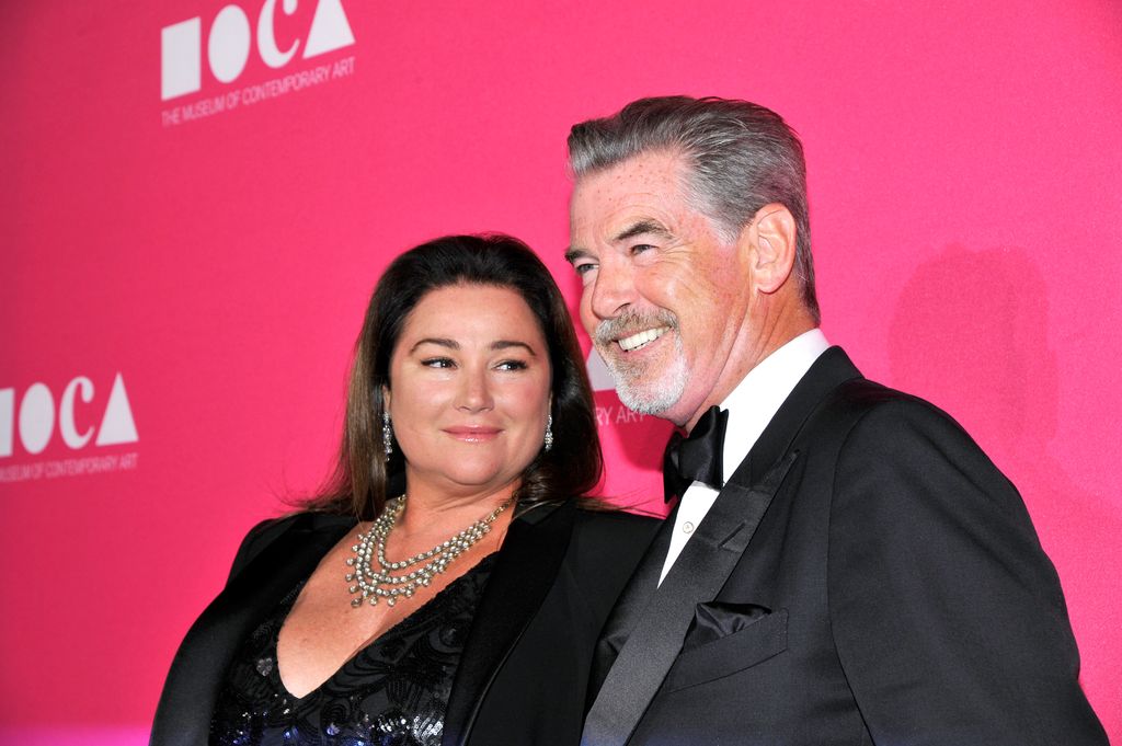 Pierce Brosnan's wife's swimsuit photos highlight their idyllic beach ...