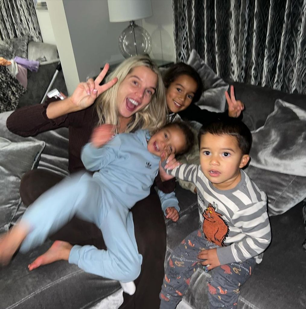 Helen Flanagan on sofa with three children