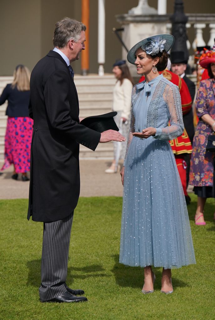 The Princess of Wales mingles with a guest