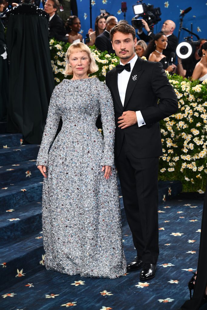 Pamela Anderson and Brandon Thomas Lee attending the Metropolitan Museum of Art Costume Institute Benefit Gala 2025