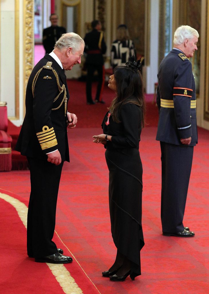 Nisha Katona being given her MBE by the King