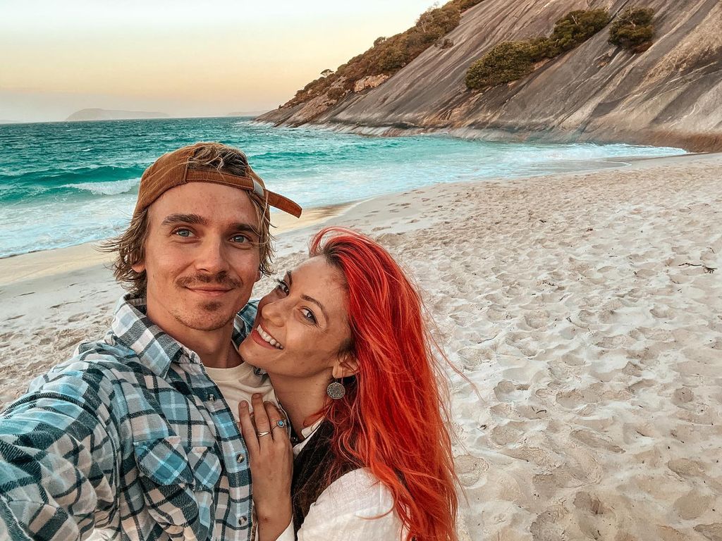 couple cuddling on beach