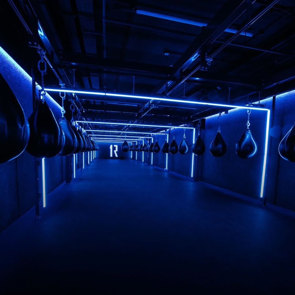 inside 1Rebel Rumble studio with punching bags descended from ceiling
