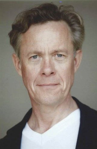 Head shot of dark-haired man 