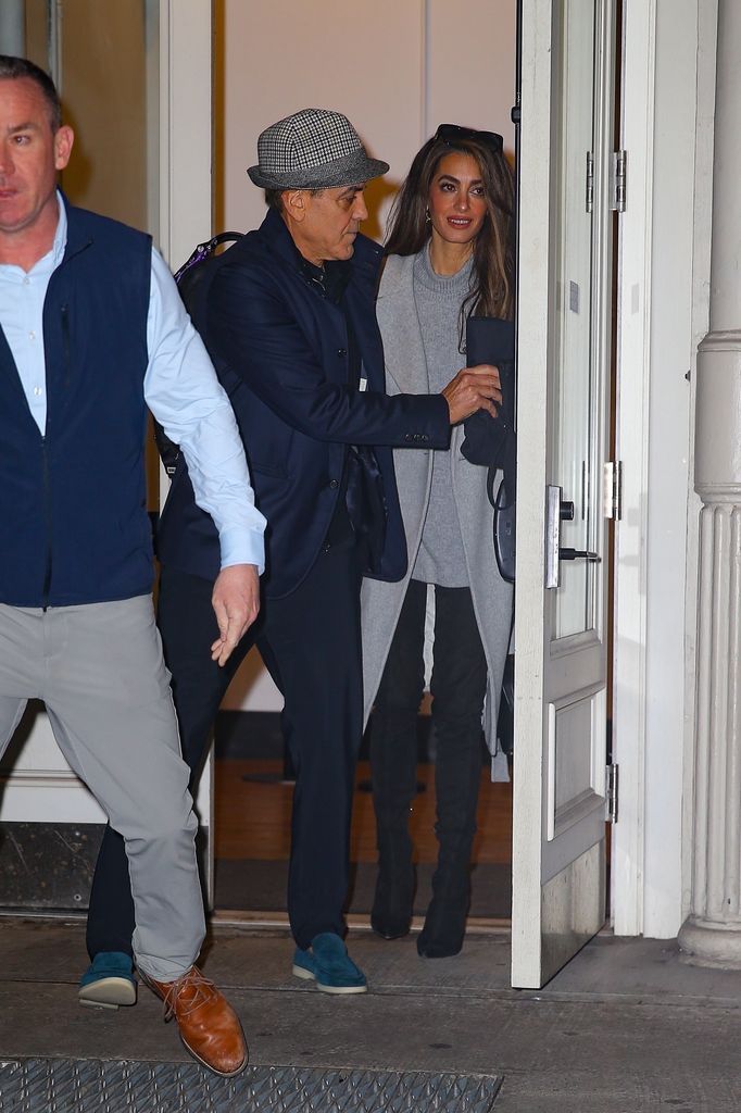 George Clooney and his wife Amal Clooney hold hands as they head out together in New York.