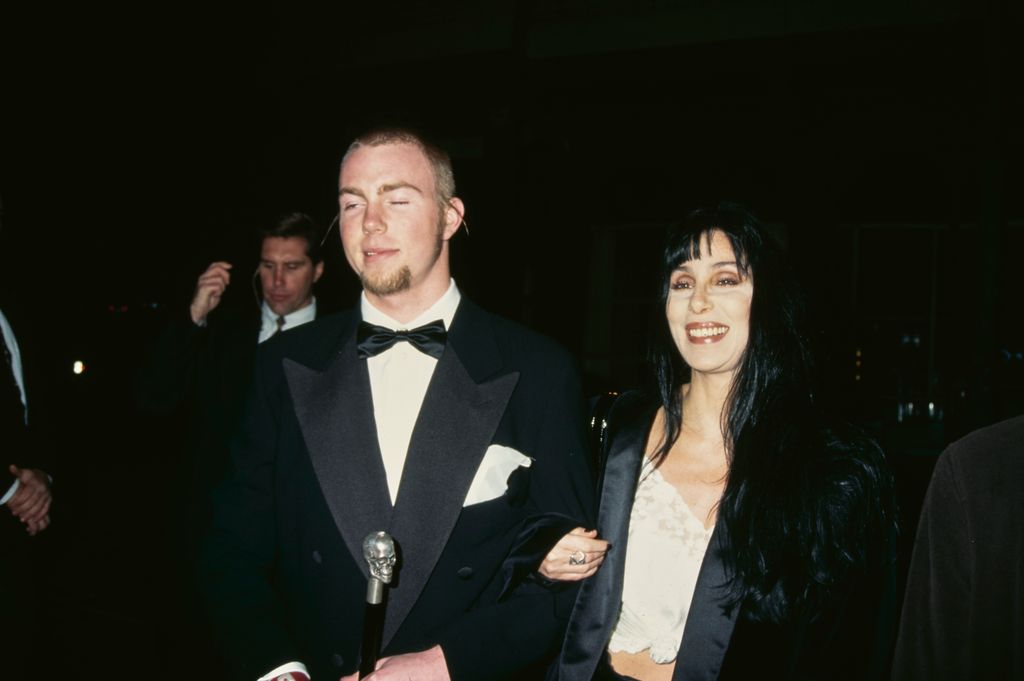 Elijah Blue Allman and American singer and actress Cher attend the 5th Annual Fire and Ice Ball to Benefit Revlon UCLA Women Cancer Centre held at the 20th Century Fox Studios in Century City, California, United States, 7th December 1994.  (Photo by Vinnie Zuffante/Getty Images)