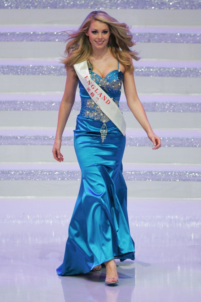 Georgia Horsley walking Miss World in a blue dress