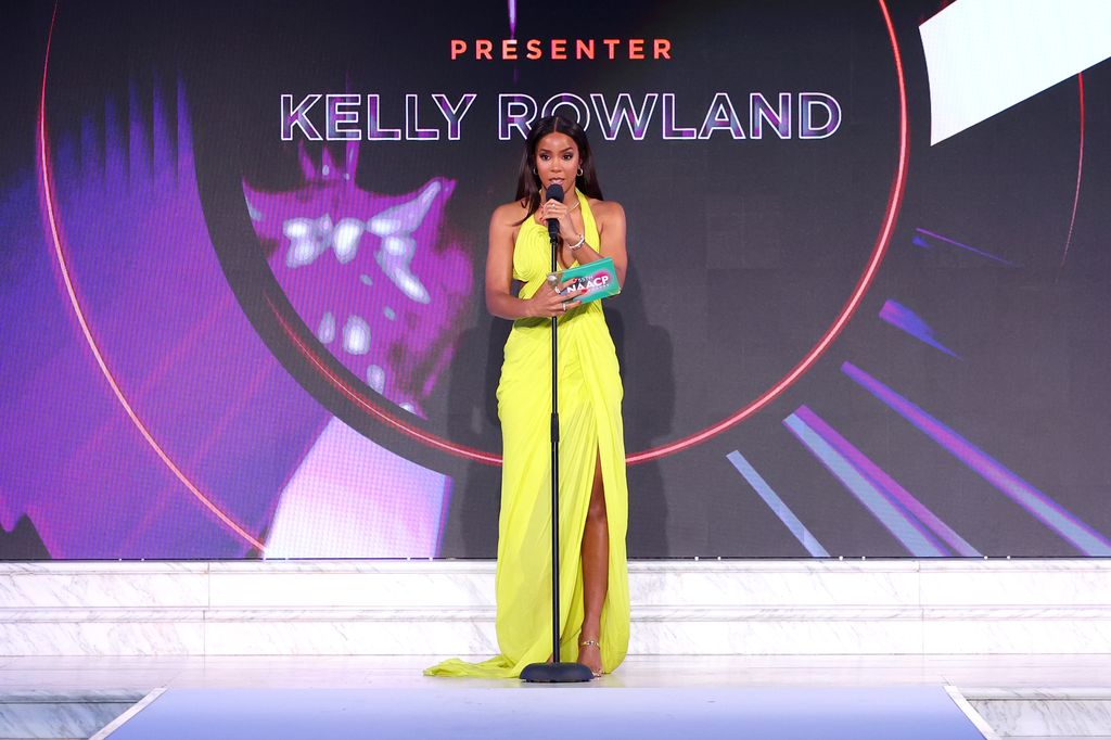 Kelly Rowland speaking onstage during the NAACP Fashion Show