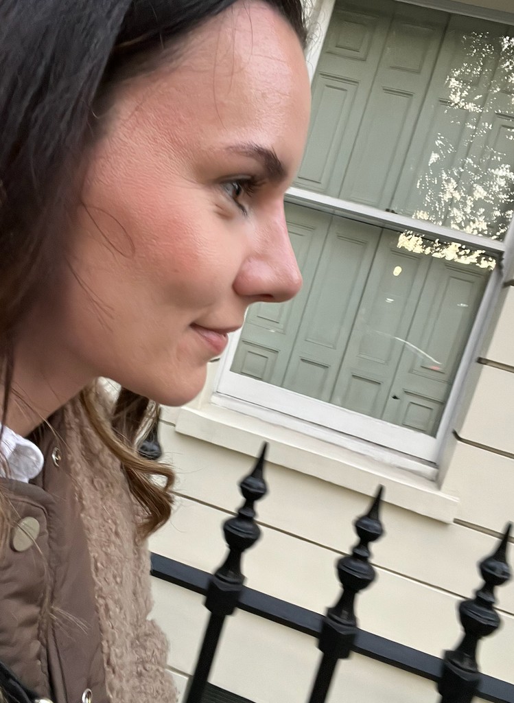 woman taking selfie in street