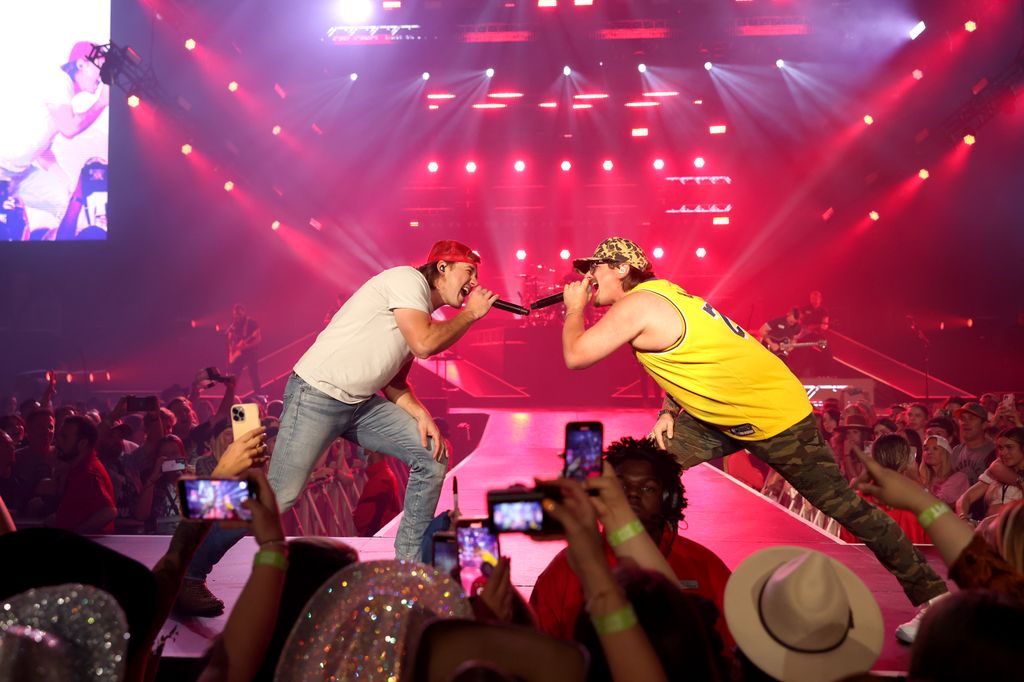 Morgan Wallen and HARDY perform onstage during Morgan Wallen's Dangerous Tour in 2022