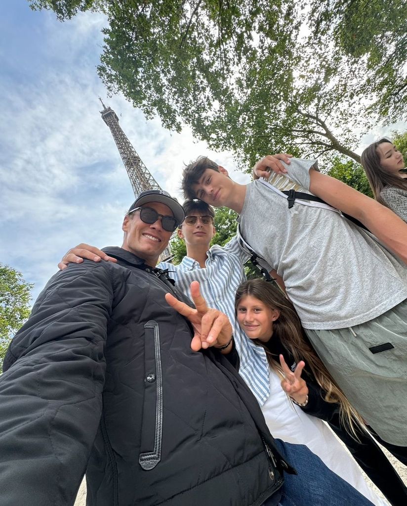 Tom Brady and his three children Benjamin, Vivian, and Jack pose for a selfie in front of the Eiffel Tower in Paris, shared on Instagram