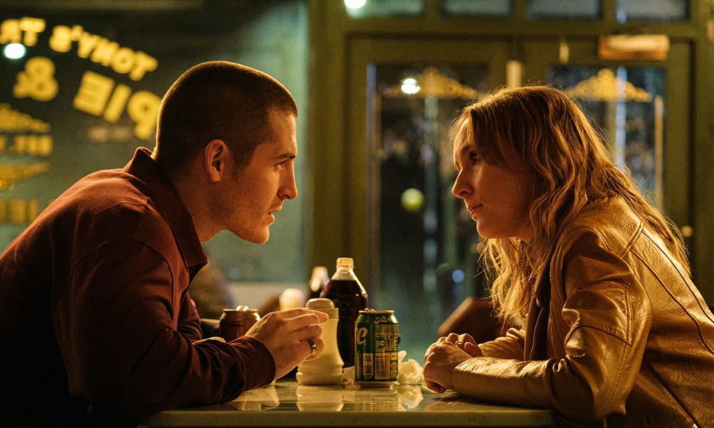 Man and woman sitting at table in diner