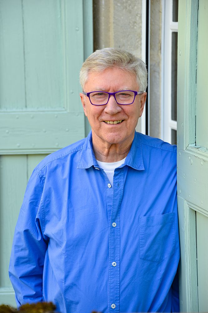 Robin Ellis wearing a blue shirt 