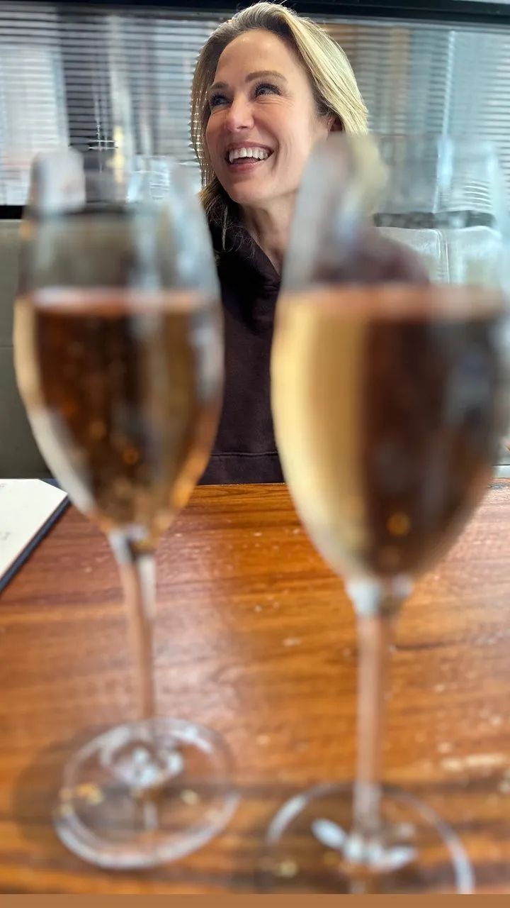 Amy and TJ enjoy a celebratory champagne