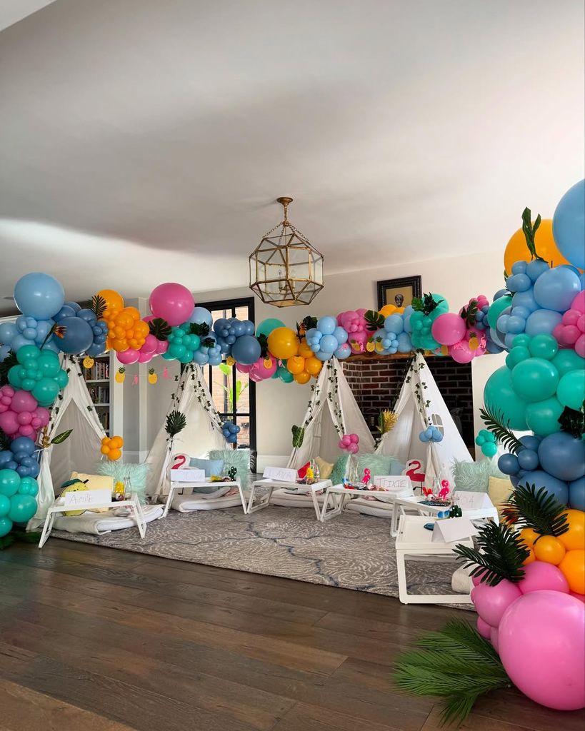 Emma Willis' living room decorated with teepee tents and balloons