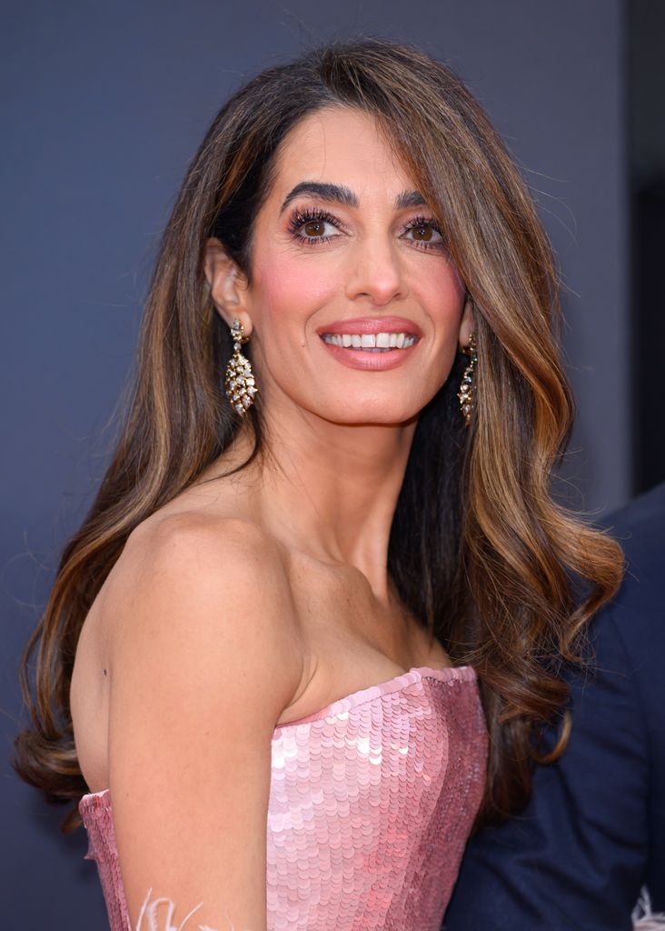 Amal Clooney posed in strapless pink dress