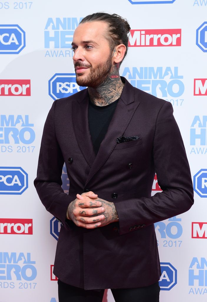 man in suit at awards ceremony