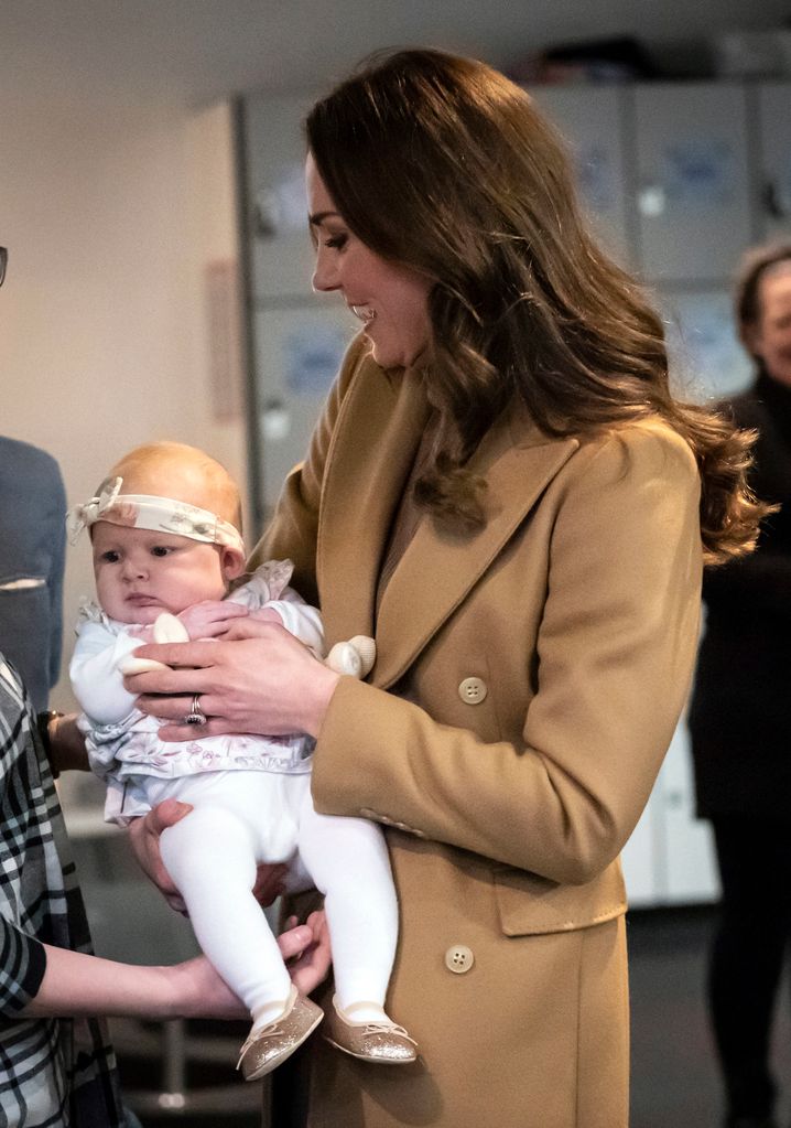 Kate Middleton holding baby Anastasia Barrie in Lancashire