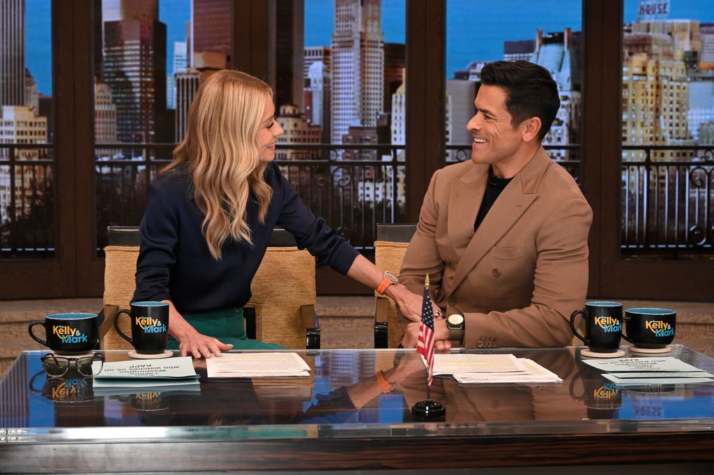 Kelly Ripa and Mark Consuelos in the Live studios 