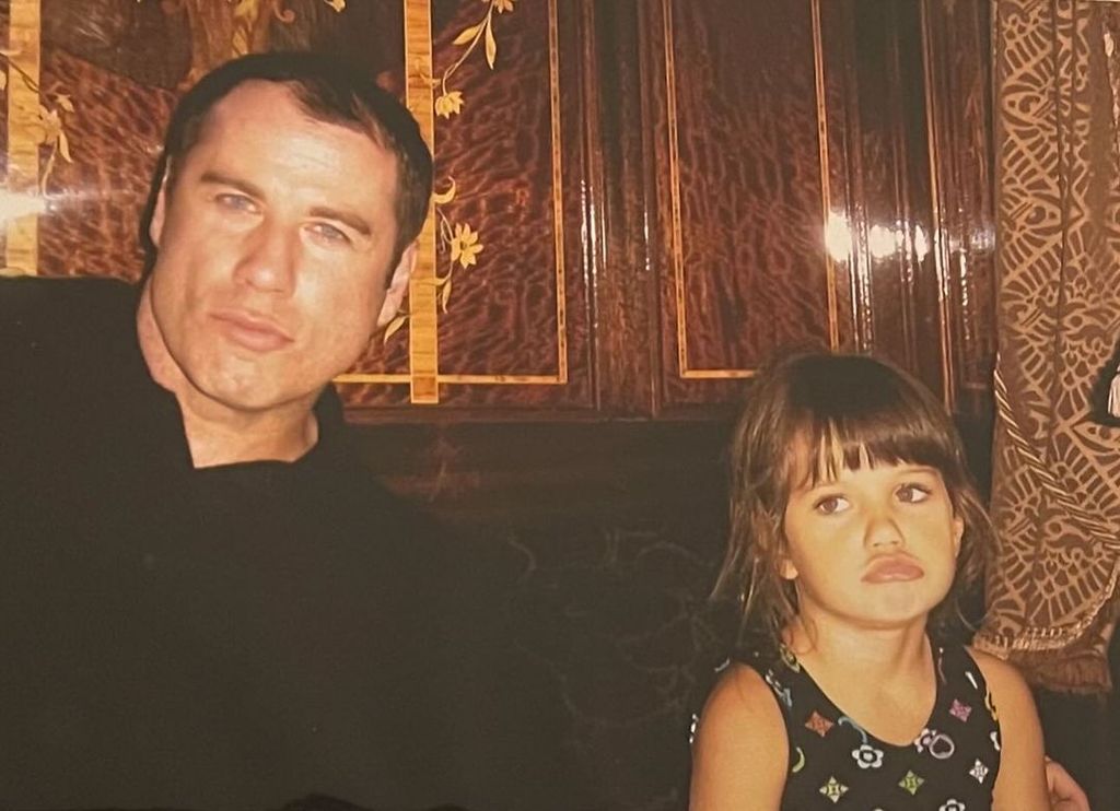 John in a throwback image with daughter Ella