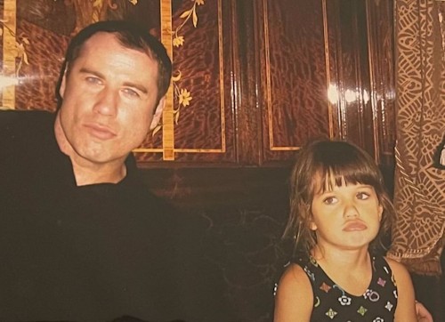 John in a throwback image with daughter Ella