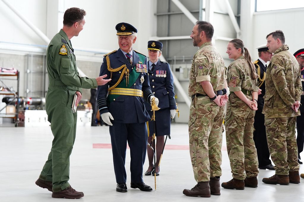 Britain's King Charles III reacts during a visit to RAF (Royal Air Force) Lossiemouth in Moray, to re-present a Squadron Standard to 42 Torpedo Bomber Squadron