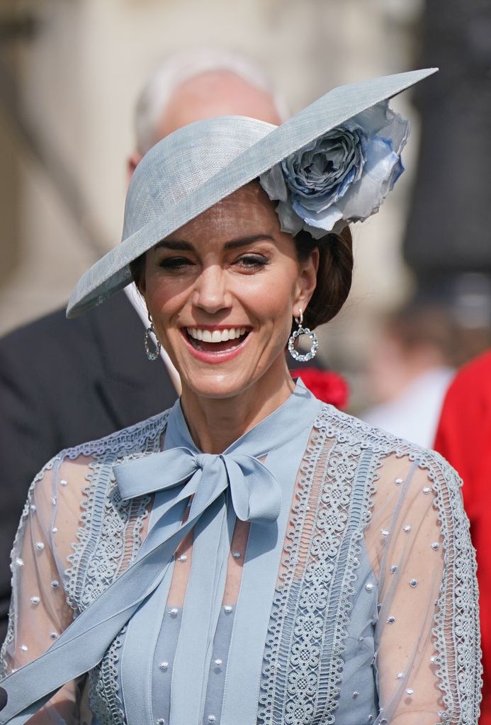 Kate accessorised with a Philip Treacy hat and statement earrings