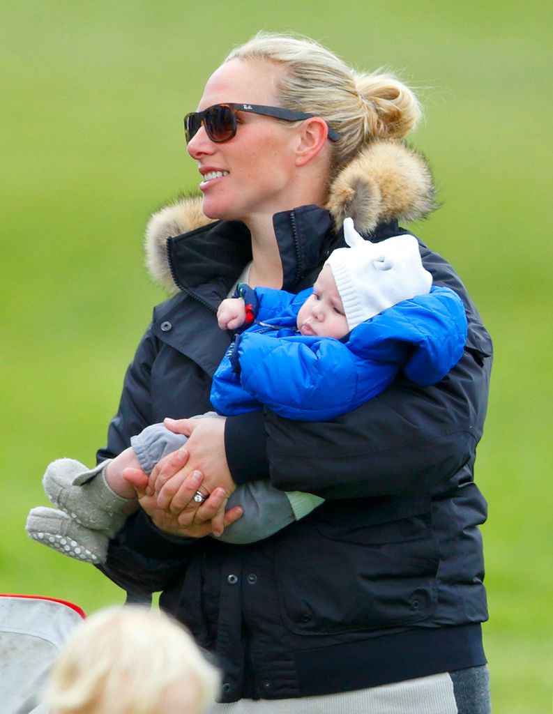 Zara Tindall carrying a baby Mia Tindall