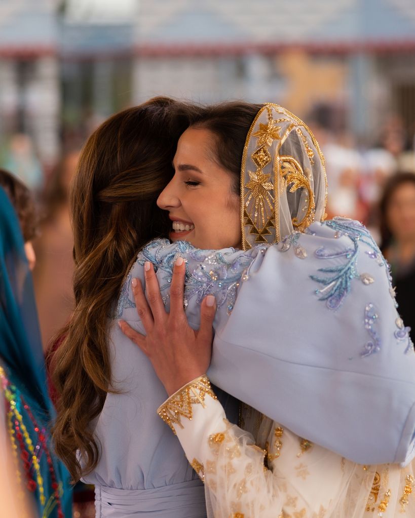 Queen Rania hugging her future daughter-in-law Rajwa Al Saif at her traditional pre-wedding henna party
