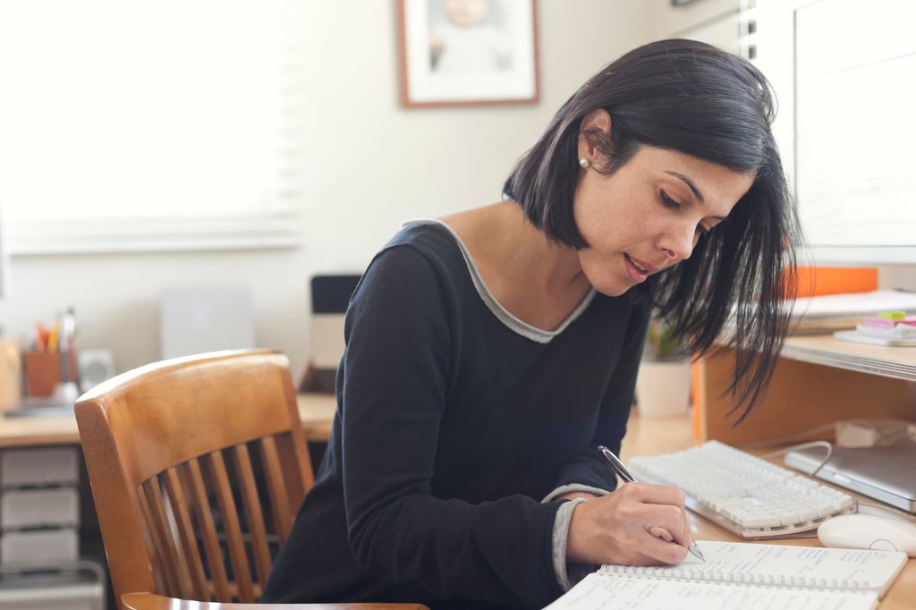 Woman setting goals in the office